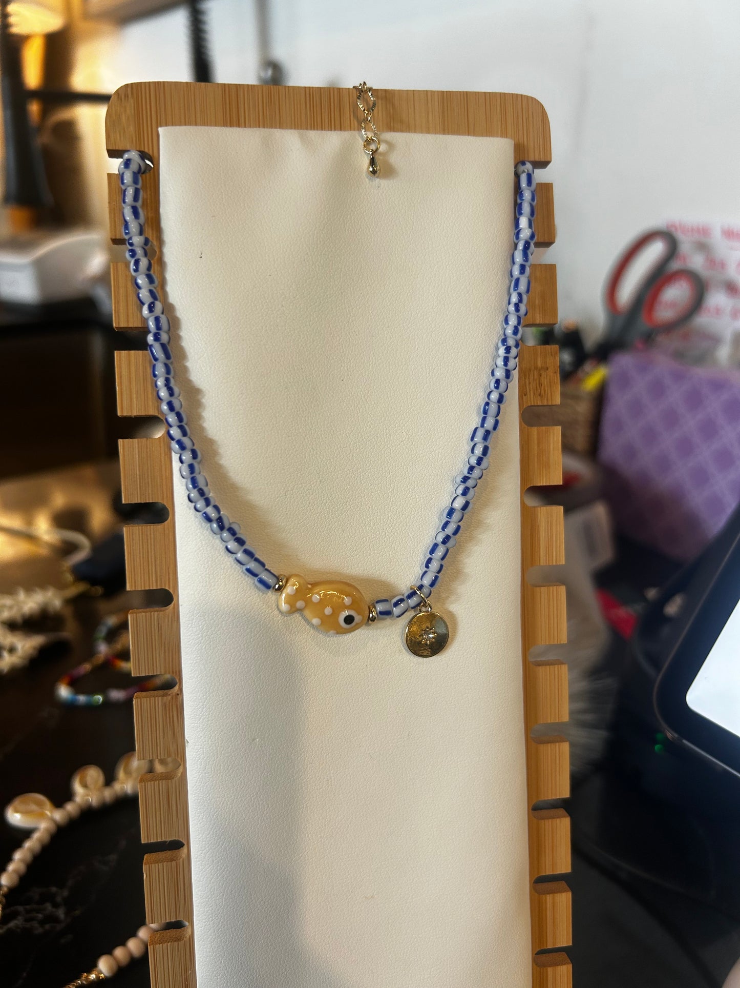 Blue and white beaded fish necklace
