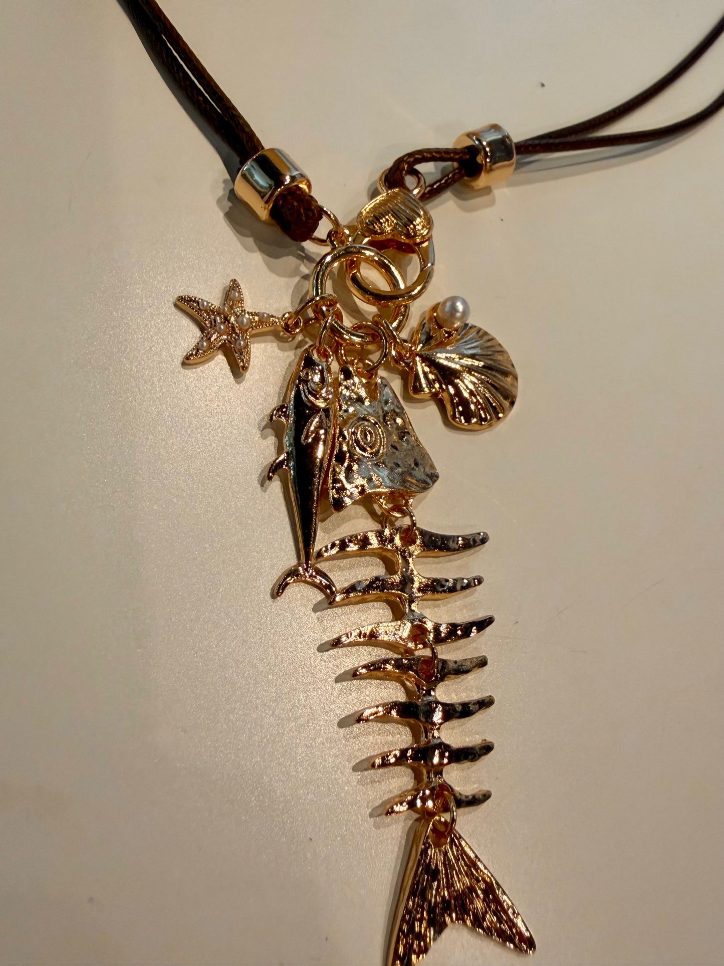 Fish Charms on Brown Leather Necklace